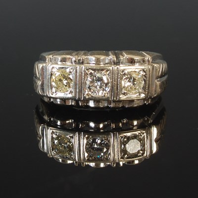 Lot 61 - A 14k white gold ring, set with three diamonds...