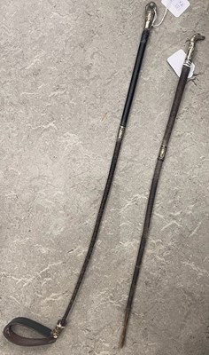 Lot 571 - Two late 19th century whips, with cast silver...