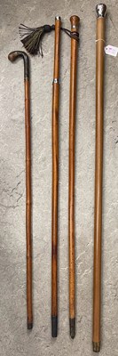 Lot 567 - Four assorted walking canes, to include a...