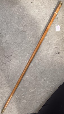 Lot 565 - An antique yellow metal mounted Malacca cane,...