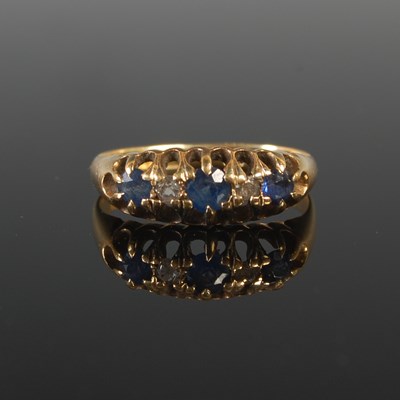 Lot 58 - An 18ct gold sapphire and diamond five stone...