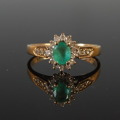 Lot 72 - A 9ct gold emerald and diamond cluster ring,...