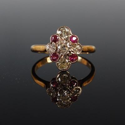 Lot 74 - A white and yellow metal diamond and garnet...