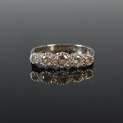 Lot 79 - A white metal and diamond five stone ring, the...