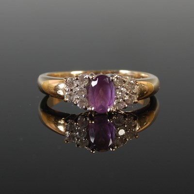 Lot 83 - A 9ct gold amethyst and diamond cluster ring,...