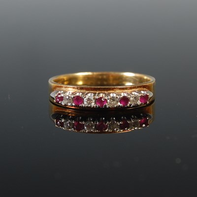 Lot 85 - A yellow metal ruby and diamond nine stone...