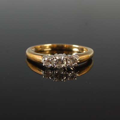 Lot 88D - An 18ct gold and diamond three stone ring,...