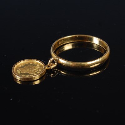 Lot 99 - A yellow metal ring stamped '916', suspending...