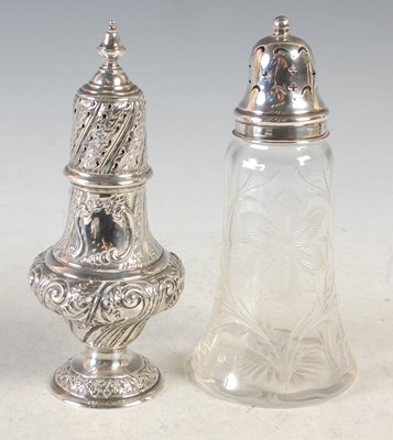 Lot 130 - A London silver sugar caster embossed with...
