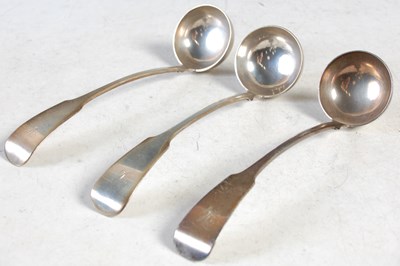 Lot 135 - A set of three George IV silver sauce ladles,...
