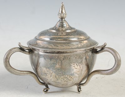 Lot 140 - An Indian silver three-handled cup and cover,...