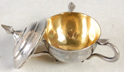 Lot 140 - An Indian silver three-handled cup and cover,...