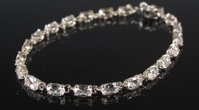 Lot 212 - A 9ct white gold and clear gem stone set...