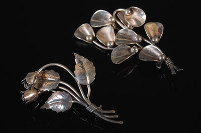 Lot 216 - Two Danish Sterling silver flower brooches,...