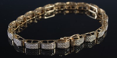 Lot 217 - A 9ct gold and gem set articulated bracelet,...