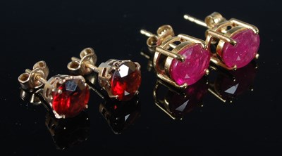 Lot 238 - A pair of yellow metal mounted garnet stud...