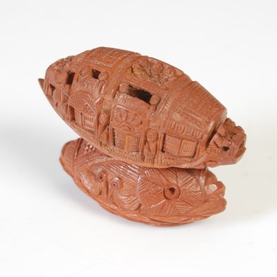Lot 260 - A Chinese coquilla nut carving of a model junk...