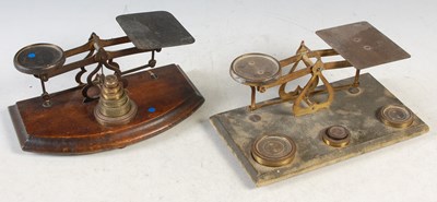 Lot 371 - Two vintage wood and brass table top postage...