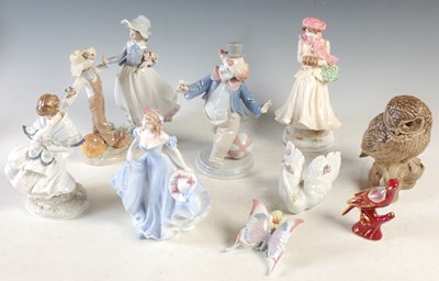 Lot 383 - A collection of nine assorted ceramic figures...