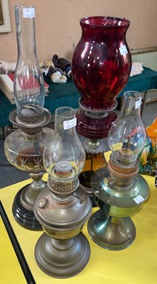 Lot 447 - Assorted paraffin burning oil lamps.