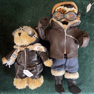 Lot 458 - A teddy bear fashioned as a pilot; together...