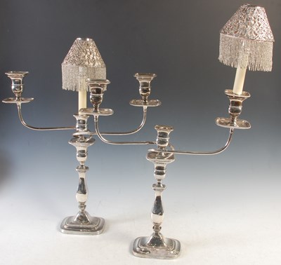 Lot 473 - A pair of three light electroplated candelabra,...