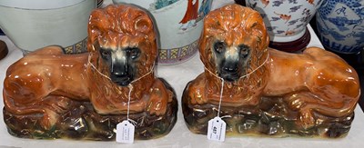 Lot 487 - A pair of Scottish pottery lions, with tan...