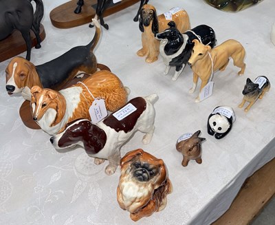 Lot 492 - A collection of eight assorted Beswick dog...
