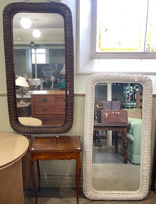 Lot 639 - A rounded rectangular wall mirror in woven...