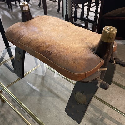 Lot 651 - A darkwood and brass studded camel stool, with...