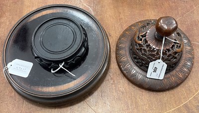 Lot 496 - A Chinese darkwood circular vase stand,...