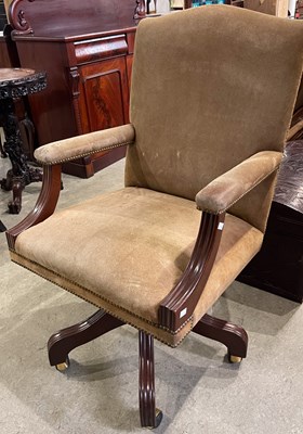 Lot 653 - Arthur Brett, a tan coloured suede swivel desk...