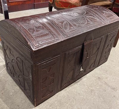 Lot 654 - A 20th century leather covered dome top trunk,...
