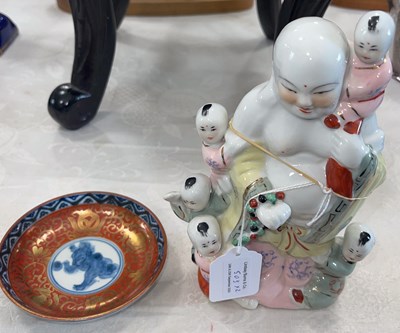Lot 503 - A Chinese porcelain figure of Buddha and five...