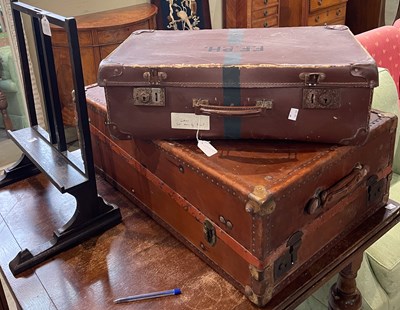 Lot 667 - A vintage brown leather covered travel trunk,...