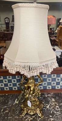 Lot 679 - A gilt brass cherub formed table lamp and...