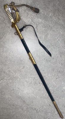 Lot 555 - A George VI Naval Officers sword and scabbard...