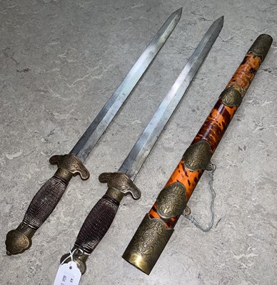 Lot 553 - A Chinese brass mounted double short sword in...