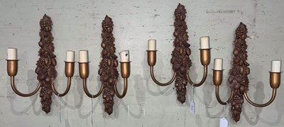 Lot 693 - Four composite gilt two light wall sconces...