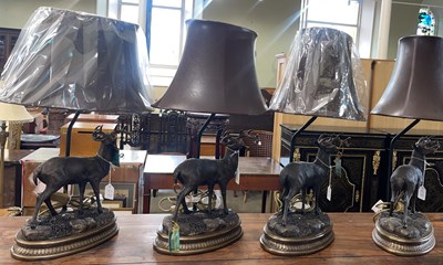 Lot 718 - Four composite stag form table lamps and...