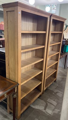 Lot 698 - A pair of contemporary blonde oak open...