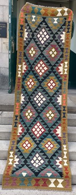 Lot 798 - A Maimana Kilim runner, the black and green...