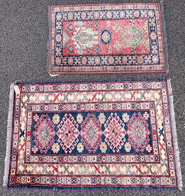 Lot 799 - A small Super Kazak rug, the rectangular blue...