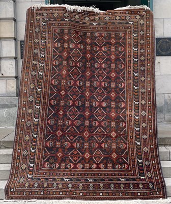 Lot 805 - A Persian rug, the rectangular charcoal...