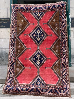 Lot 814 - A Persian Hamedan rug, the madder ground...