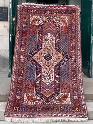 Lot 815 - A Persian Quchan rug, the rectangular blue...