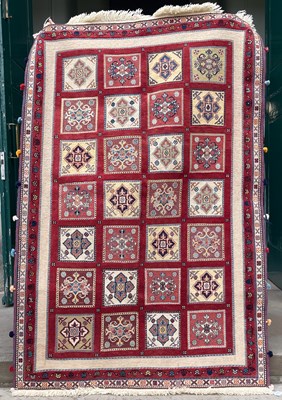 Lot 817 - A Persian part pile carpet, the pale pink...