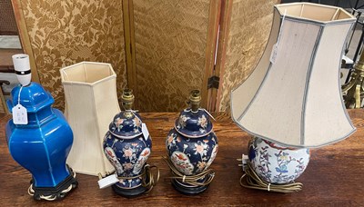 Lot 735 - A pair of blue ground porcelain table lamps,...