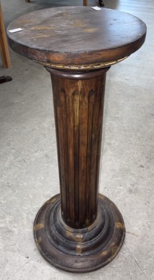 Lot 738 - A stained wood pedestal, the circular top on...