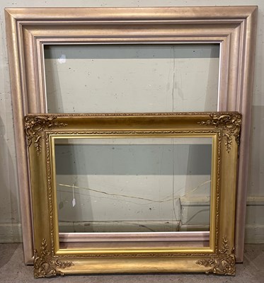 Lot 762 - A giltwood picture frame with shell and scroll...